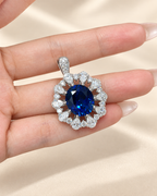 Oval Cut Royal Blue Lab-Grown Sapphire Sunburst Halo High Jewelry Statement Pendant